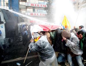 Deluge: crowds take cover (Image: Justin Sullivan/Getty)